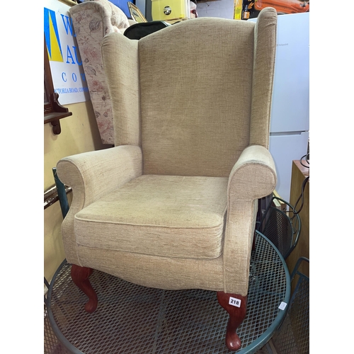 218 - FABRIC UPHOLSTERED WING ARMCHAIR