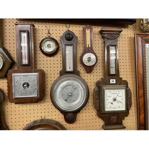 23 - CARVED OAK ANEROID BAROMETER AND TWO OTHER EXAMPLES