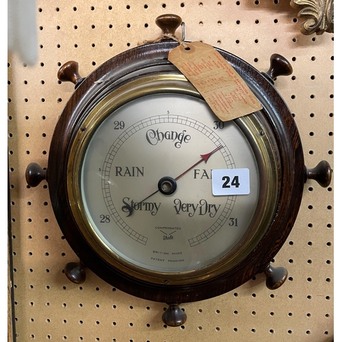 24 - SHIP'S WHEEL COMPENSATED BAROMETER AND ONE OTHER ROUNDEL BAROMETER