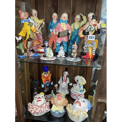 253 - COLLECTION OF CERAMIC POTTERY AND GLASS CLOWN FIGURES FACE MASKS AND MODELS