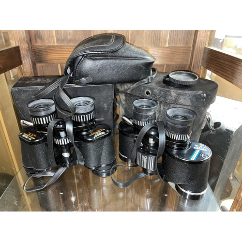 254 - CHINON 7-15X35 BINOCULARS, AND TASCO ZOOM BINOCULARS