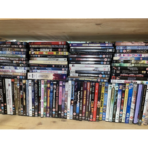 265 - TWO SHELVES OF DVDS