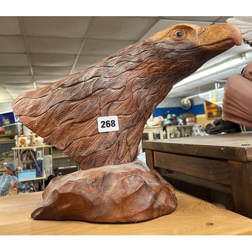 268 - CARVED WOODEN EAGLES HEAD ON BASE