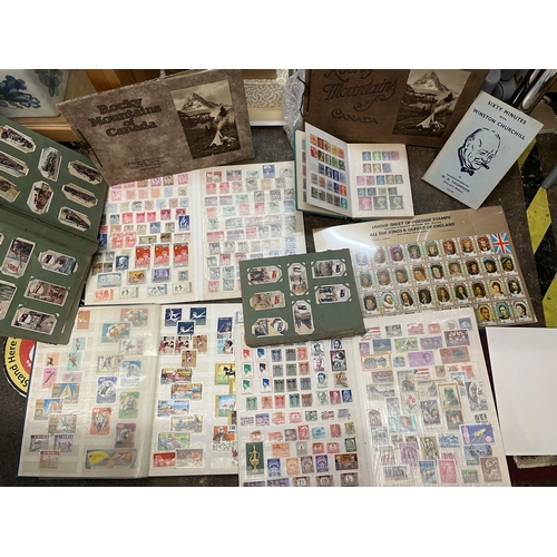 330 - POSTAGE STAMP ALBUMS, CIGARETTE CARD ALBUM AND A COLOURED PICTORIAL BOOK OF THE ROCKY MOUNTAINS OF C... 