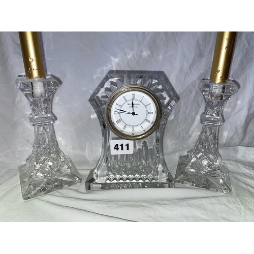 411 - WATERFORD CRYSTAL MANTLE CLOCK AND PAIR OF CANDLE HOLDERS