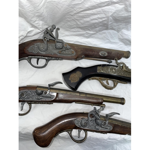 425 - TWO PAIRS OF REPLICA DECORATIVE FLINT LOCK PISTOLS