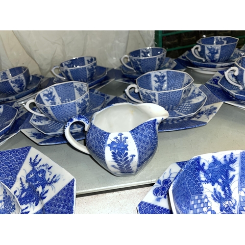 437 - JAPANESE BLUE AND WHITE OCTAGONAL TEA SET WITH LARGER PLATES AND BOWL