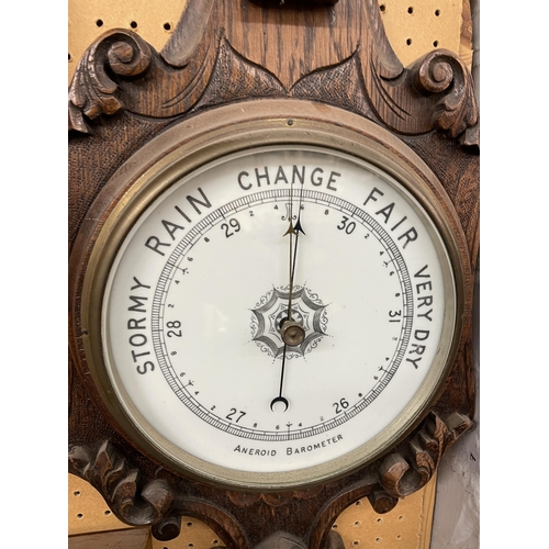 473 - OAK CARVED CASED ANEROID BAROMETER