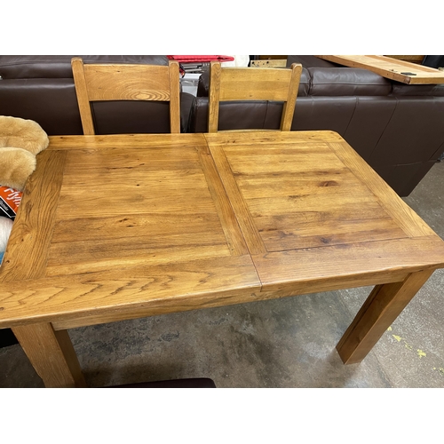 57 - MATCHING OAK EXTENDING DINING TABLE AND FOUR LADDERBACK CHAIRS