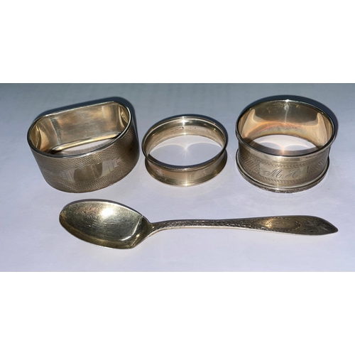 558 - THREE SILVER NAPKIN RINGS AND A SILVER SPOON 1.3OZ APPROX