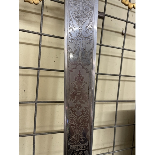 568 - REPRODUCTION DECORATIVE TOLEDO ENGRAVED SWORD