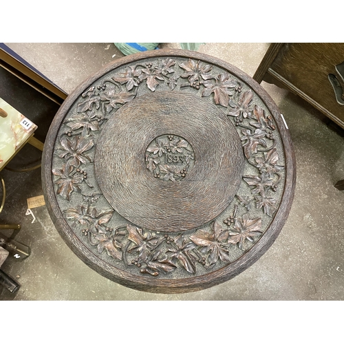 110 - CARVED CIRCULAR TOPPED CRICKET TYPE TABLE