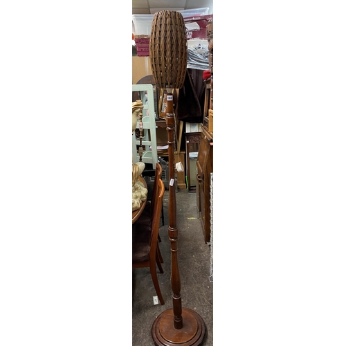 182 - WALNUT LAMP STANDARD WITH A VINTAGE WICKER OVOID SHADE