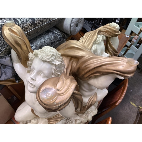 184 - CREAM AND GILDED FIBRE GLASS CHERUB TABLE BASE