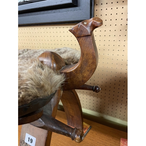 19 - CARVED CAMEL HEAD AND HIDE SADDLE STOOL