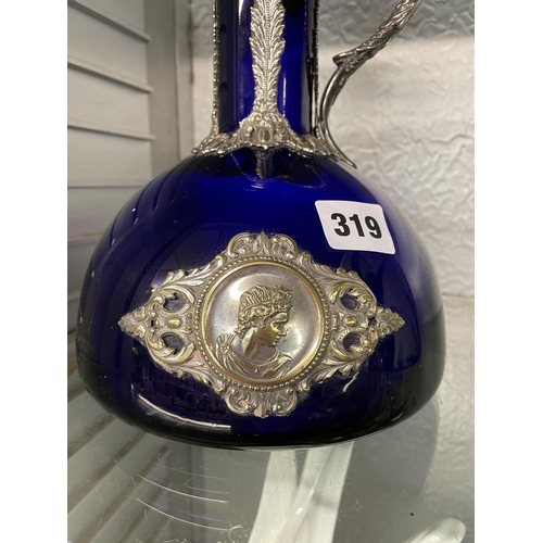 319 - BRISTOL BLUE CLARET JUG WITH EPNS MOUNTS