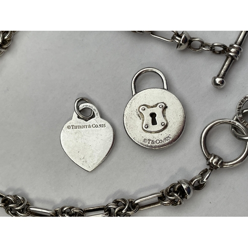 416 - 925 SILVER KNOTTED PAPER CLIP LINK BRACELET WITH TIFFANY AND CO HEART AND PADLOCK CHARMS