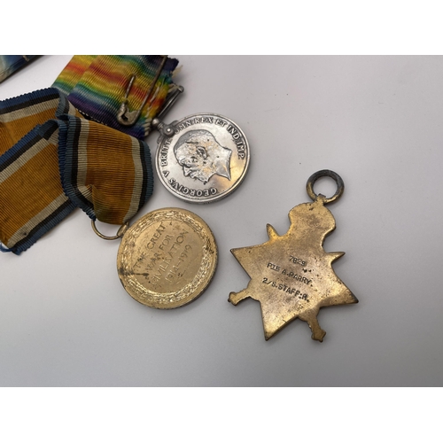 423 - WWI MEDALS 7829 TO PTE A. PARRY THE S.STAFF REGIMENT TRIO WITH DRESS BAR