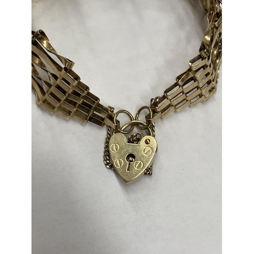 454 - 9CT GOLD GOLD SIX STRAND GATE BRACELET WITH HEART PADLOCK AND SAFETY CHAIN 13G APPROX