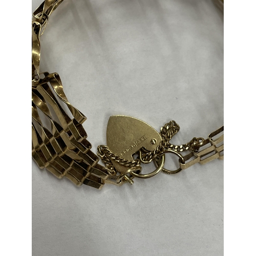 454 - 9CT GOLD GOLD SIX STRAND GATE BRACELET WITH HEART PADLOCK AND SAFETY CHAIN 13G APPROX