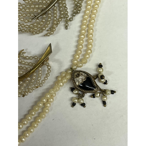 491 - TWO SEED PEARL SPRAY BROOCHES AND A TWO STRAND ENAMEL AND DROPPER NECKLACE WITH REVERSABLE PENDANTS