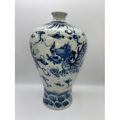 613 - CHINESE MEIPING VASE DECORATED WITH DRAGONS IN UNDER GLAZE BLUE 35CM TALL