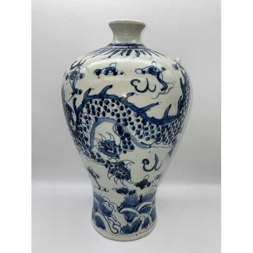 613 - CHINESE MEIPING VASE DECORATED WITH DRAGONS IN UNDER GLAZE BLUE 35CM TALL