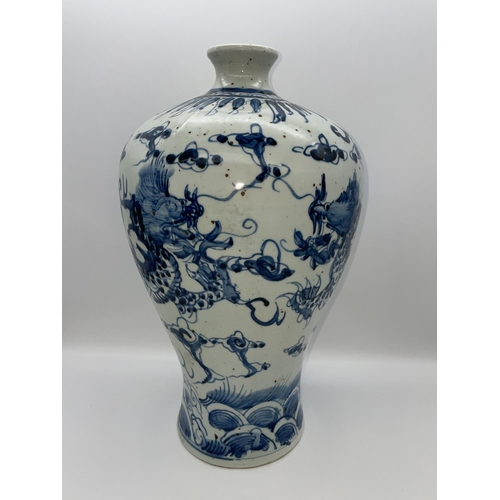 613 - CHINESE MEIPING VASE DECORATED WITH DRAGONS IN UNDER GLAZE BLUE 35CM TALL