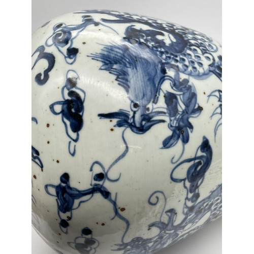 613 - CHINESE MEIPING VASE DECORATED WITH DRAGONS IN UNDER GLAZE BLUE 35CM TALL