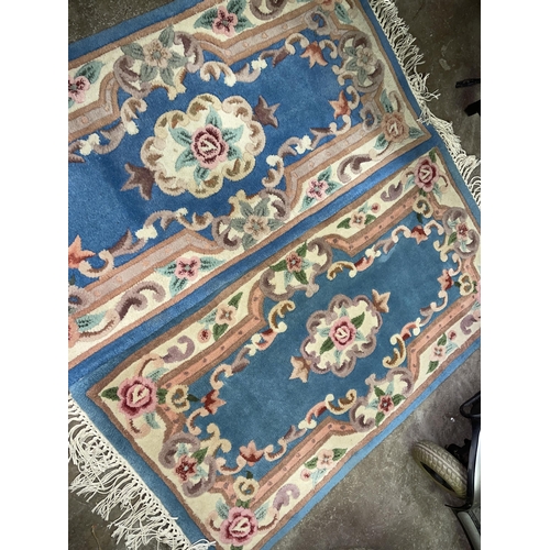 75 - TWO CHINESE BLUE PATTERNED CARPET RUNNERS