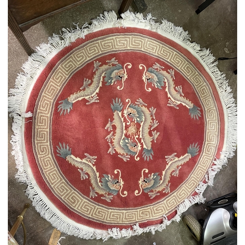 76 - CHINESE FRINGED PINK GROUND CIRCULAR RUG