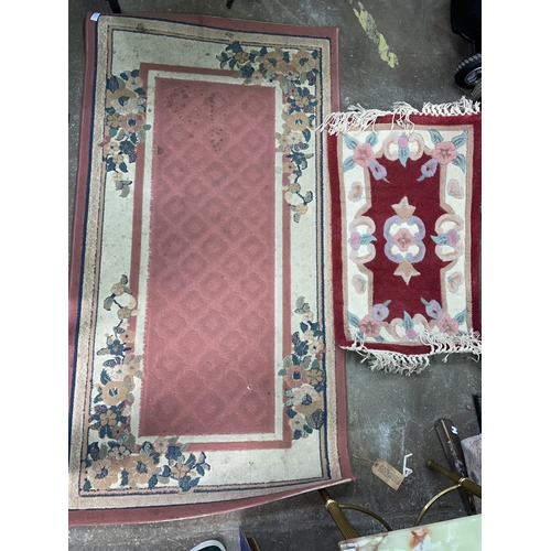 77 - PINK PATTERED CARPET RUNNER AND A DEEP RED SMALL RUG