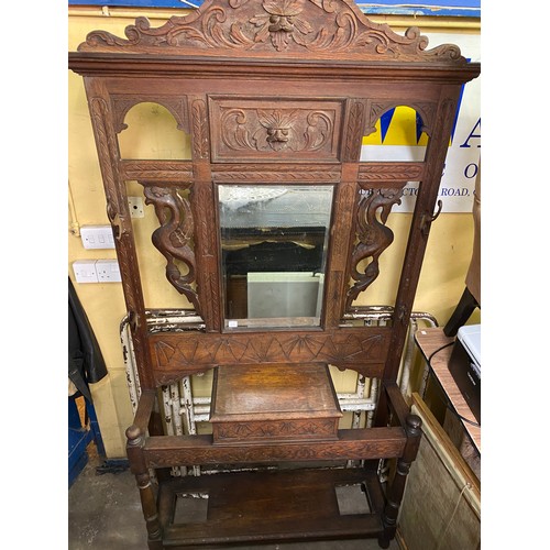 118 - LATE VICTORIAN CARVED OAK MIRRORED HALL STAND AND THREE UPHOLSTERED CHAIRS