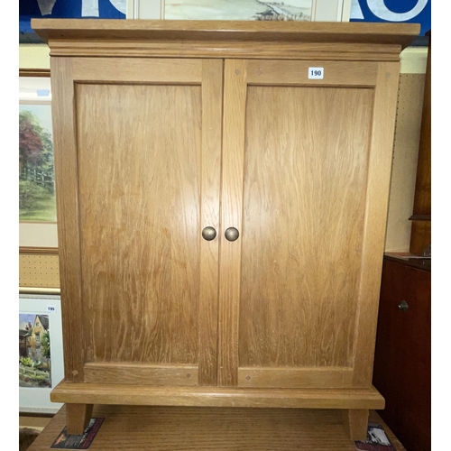 61 - CONTEMPORARY LIGHT OAK TWO DOOR MEDIA CABINET CONTAINING CDS AND DVDS height 94cm x width 79cm x dep... 