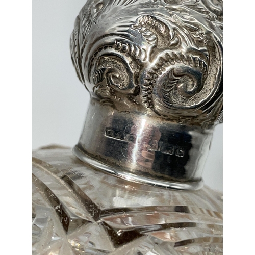 513 - SILVER TOPPED GLOBULAR SCENT BOTTLE AND A SILVER REPOUSE TOPPED BOMBE SHAPED HOBNAIL SCENT BOTTLE