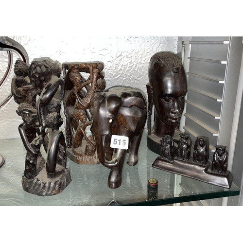 516 - PAIR OF CARVED AFRICAN FIGURAL PILLARS, ELEPHANT, AND BUST