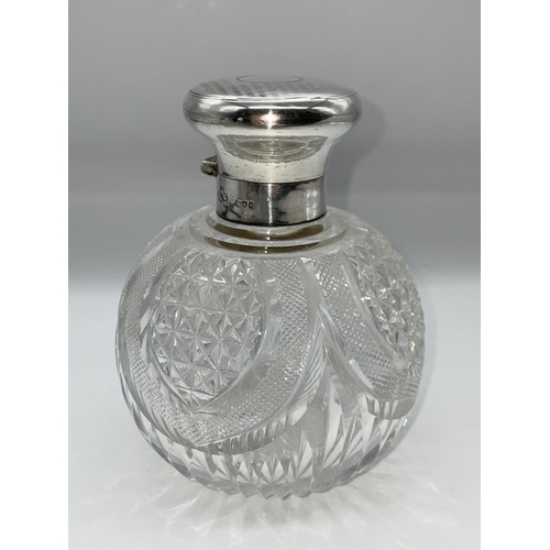 511 - SILVER TOPPED GLOBULAR BLAZE CUT AND HOB NAIL SCENT BOTTLE