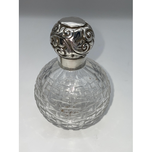 513 - SILVER TOPPED GLOBULAR SCENT BOTTLE AND A SILVER REPOUSE TOPPED BOMBE SHAPED HOBNAIL SCENT BOTTLE