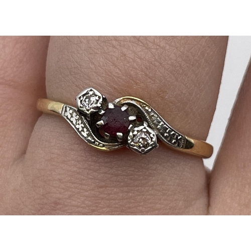 548 - 18CT YELLOW GOLD GARNET AND DIAMOND CHIP ILLUSION SET CROSS OVER RING SIZE P 3.3G APPROX