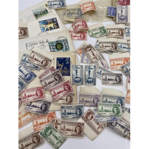 604 - SMALL BAG OF PRE WWII COMMONWELTH STAMPS FR MONTSERRAT, GAMBIA, GIBRALTAR AND OTHERS AND SOME 1ST DA... 