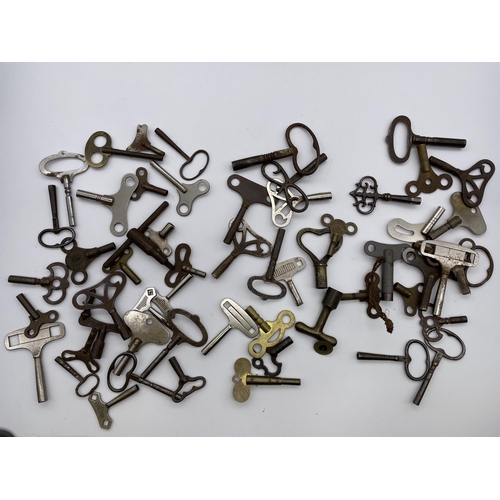 577 - THREE BAGS OF VARIOUS WATCH AND CLOCK KEYS