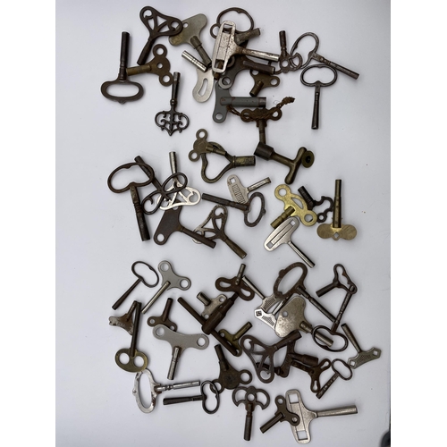 577 - THREE BAGS OF VARIOUS WATCH AND CLOCK KEYS