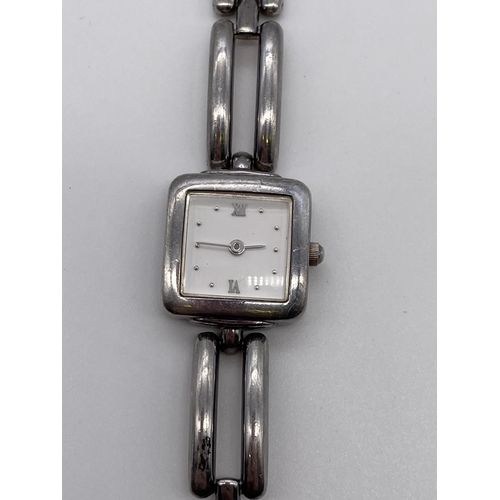 595 - LADIES SQUARE FACED WRIST WATCH ON SILVER OPEN LINK STRAP