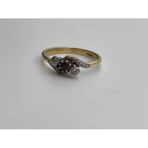 548 - 18CT YELLOW GOLD GARNET AND DIAMOND CHIP ILLUSION SET CROSS OVER RING SIZE P 3.3G APPROX