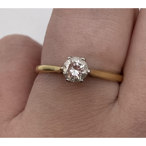 557 - STAMPED 750 18CT YELLOW GOLD AND DIAMOND SOLITAIRE RING SIZE N 2.3G APPROX