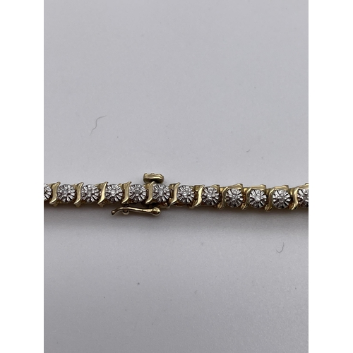 561 - 9CT GOLD AND DIAMOND ENCRUSTED TENNIS BRACELET 5.8G APPROX