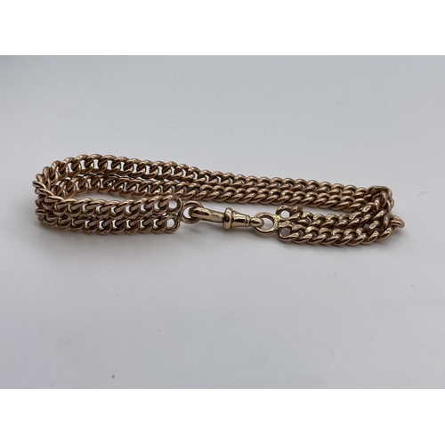 565 - 9CT ROSE GOLD DOUBLE LINK BRACELET 31.4G APPROX