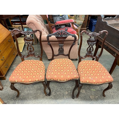 104 - LATE VICTORIAN MAHOGANY CARVED RIBBAND BACK DINING CHAIRS AND SIMILAR STYLE CHAIRS