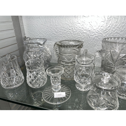 284 - TWO SHELVES OF QUALITY CUT GLASSWARES INCLUDING BISCUIT BARREL, ICE PAIL, LEMONADE JUGS, BASKETS, BO... 