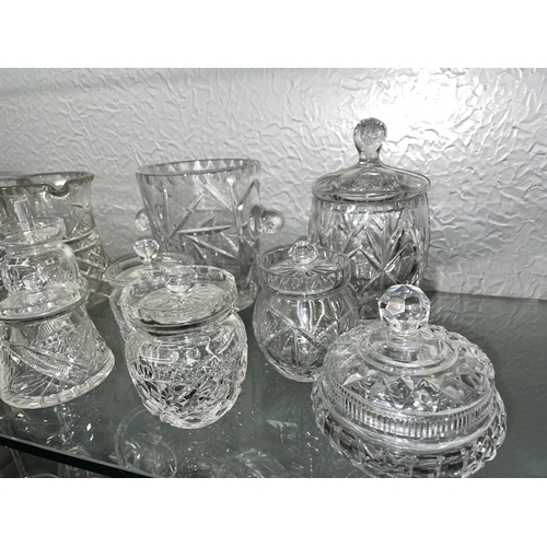 284 - TWO SHELVES OF QUALITY CUT GLASSWARES INCLUDING BISCUIT BARREL, ICE PAIL, LEMONADE JUGS, BASKETS, BO... 